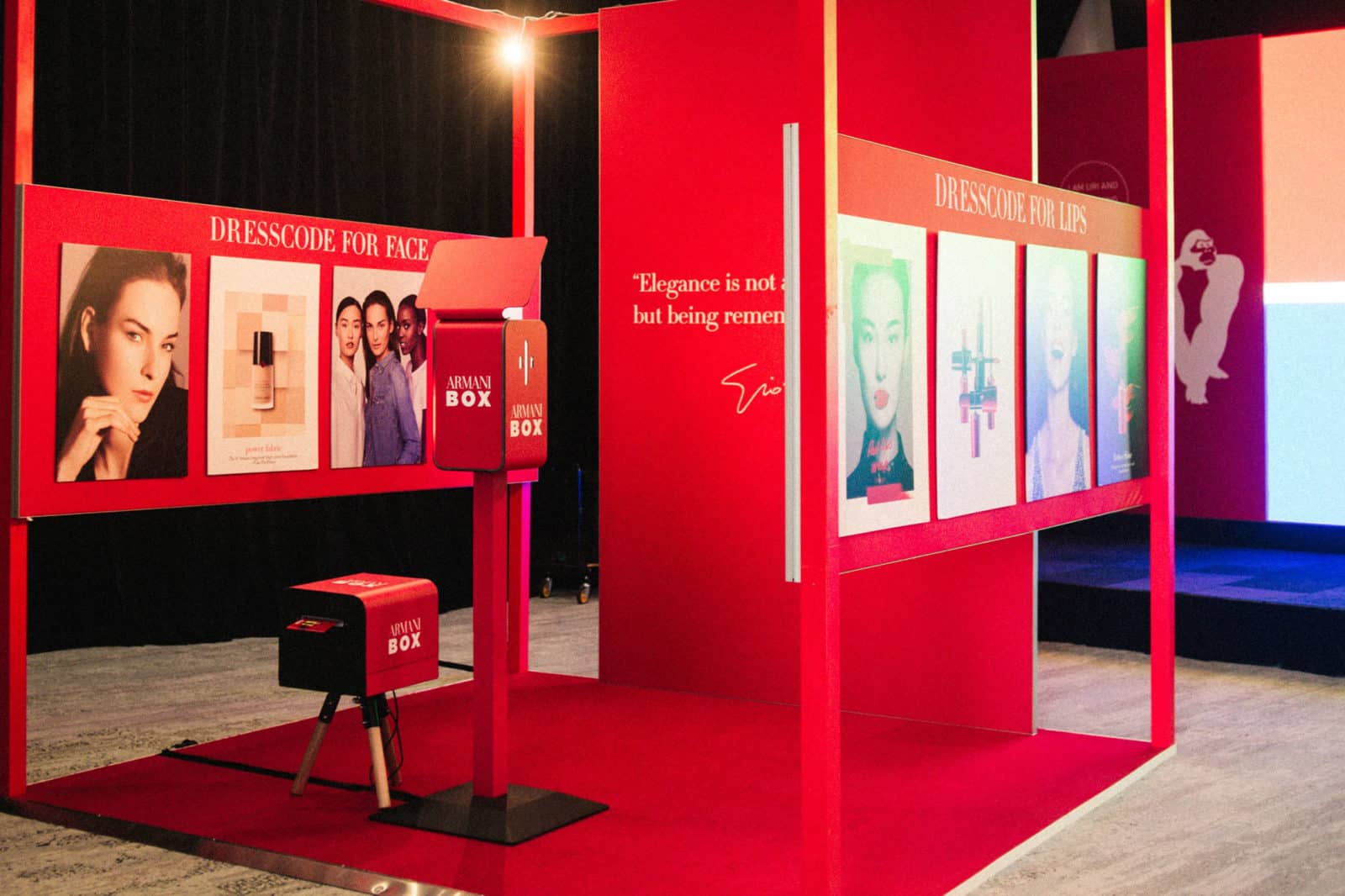 Branded Photo Booth and printer stand in red retail space